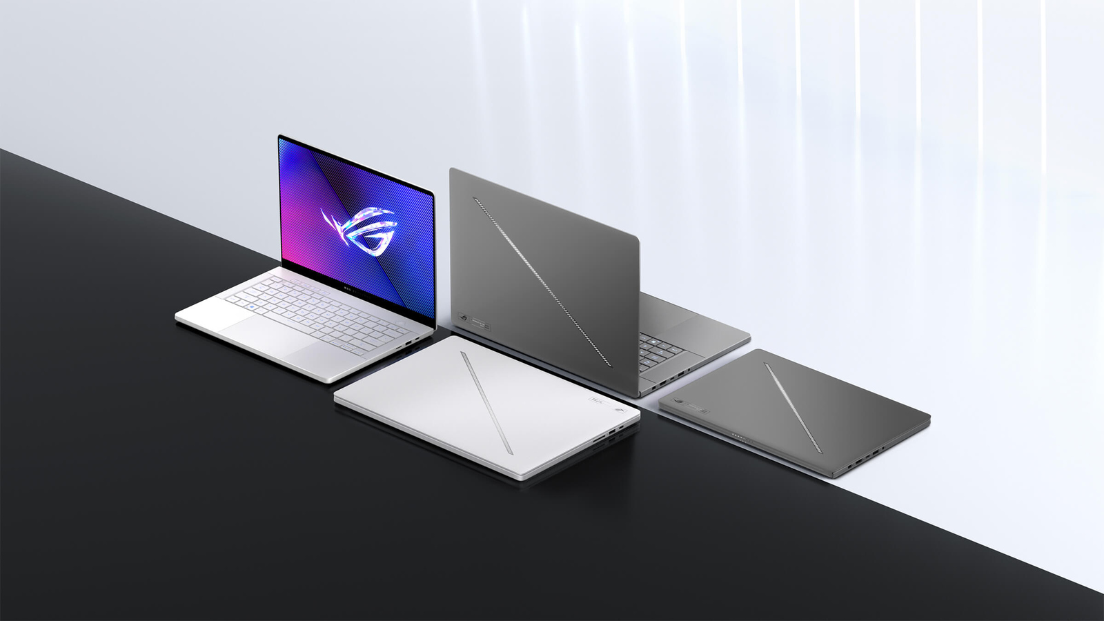 02_Zephyrus_G14_and_Zephyrus_G16_laptops_-_with_one_each_in_Eclipse_Gray_and_Platinum_White_1.jpg
